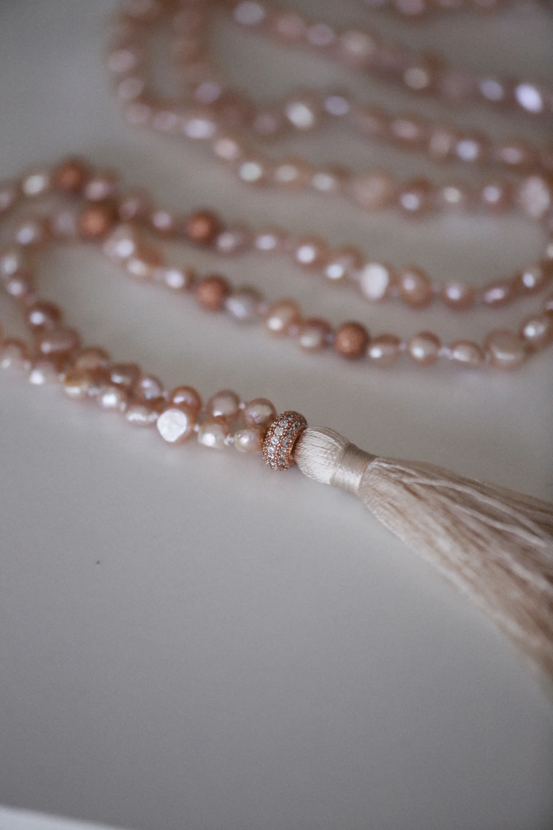 Pink pearl necklace detail