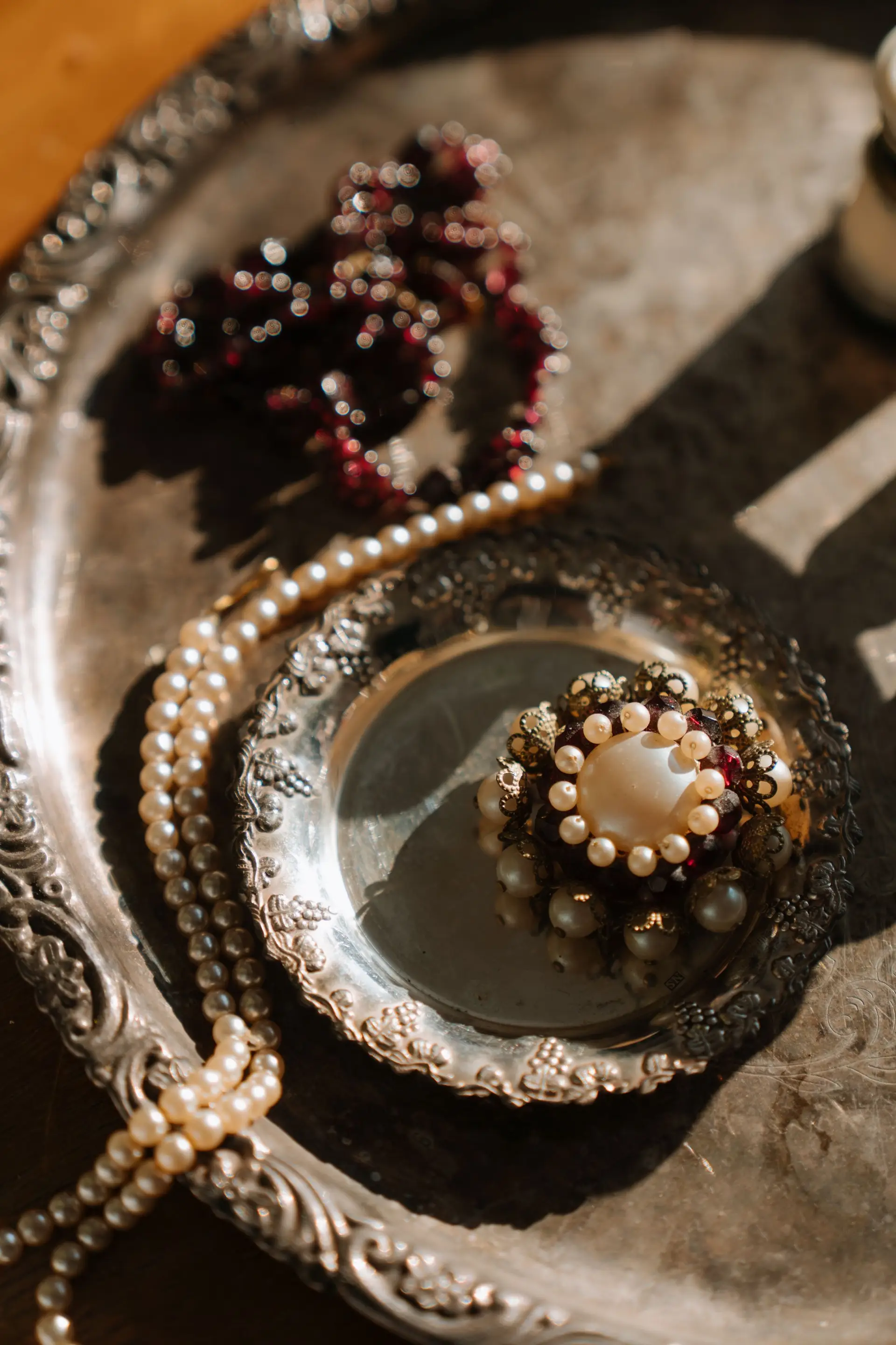 Intricate pearl and silver brooch