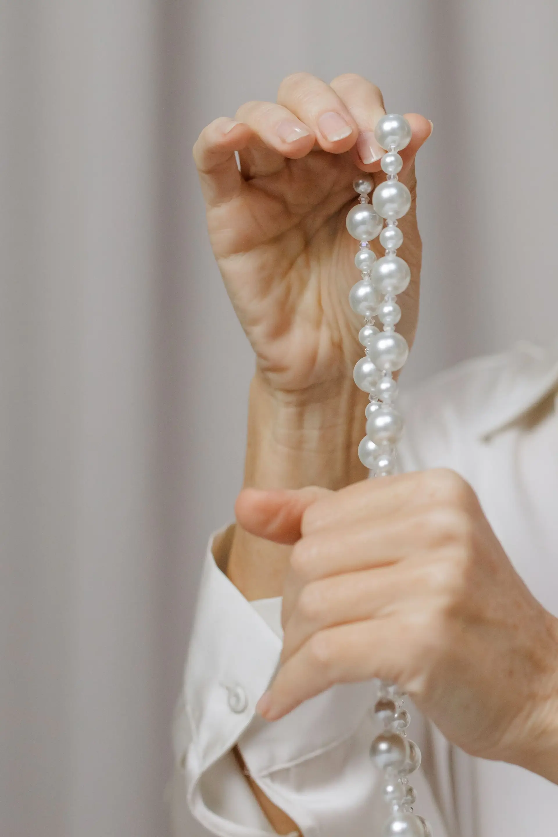 Delicate pearl earrings in studio